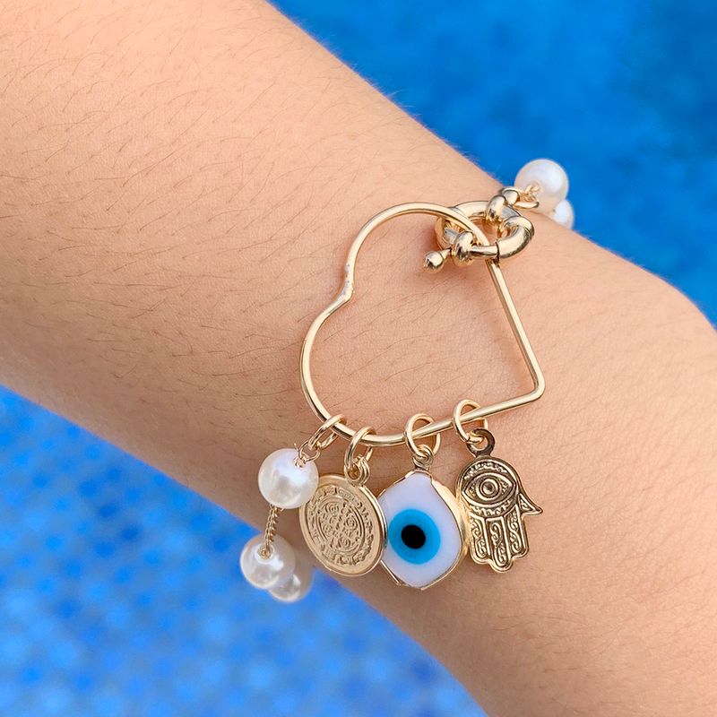 Pulseira Pérola Coração Proteção Banho de Ouro 18K