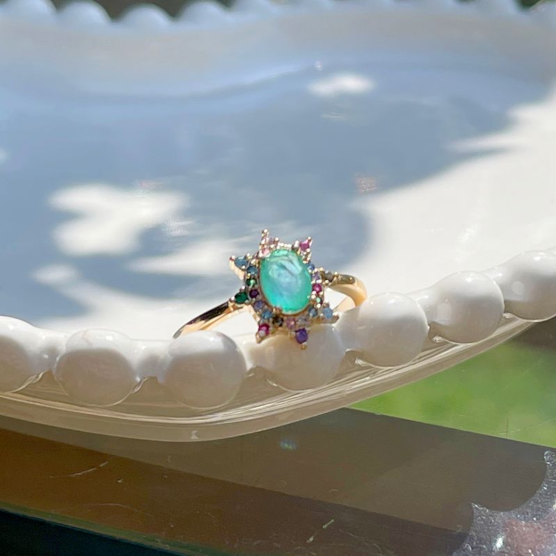 Anel-Oval-Cravejado-Fusion-Esmeralda-Colombiana-Banho-de-Ouro-18K