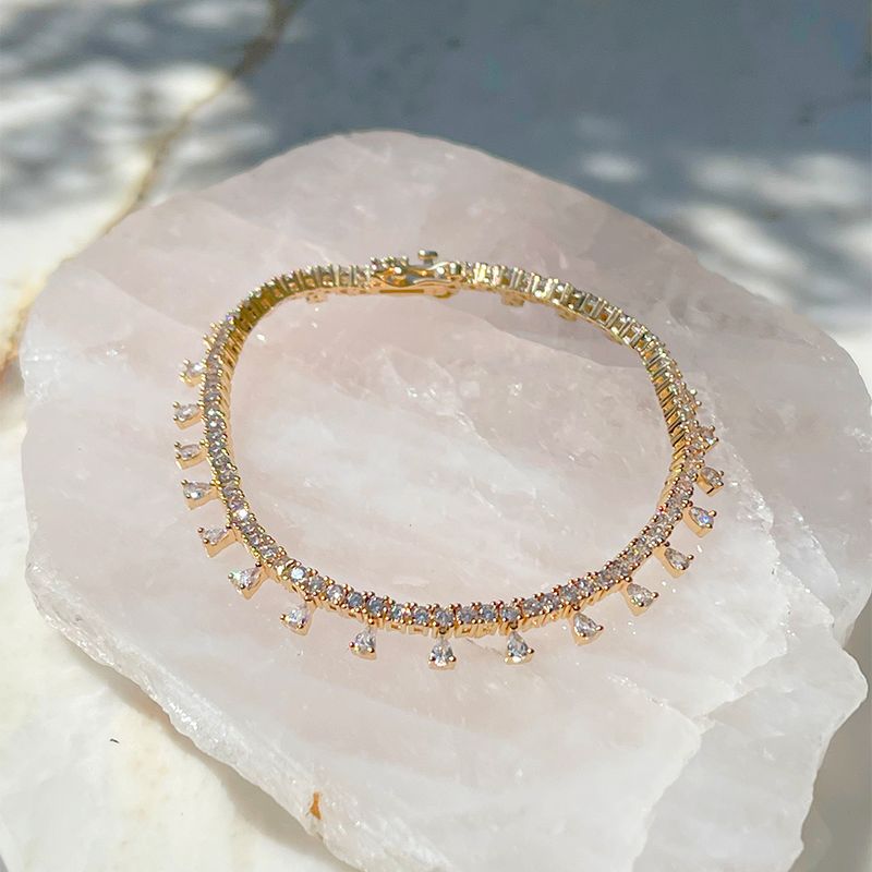 Pulseira-Chuva-de-Gotas-Cravejadas-em-Garras-Zirconia-Branca-Banho-de-Ouro-18K