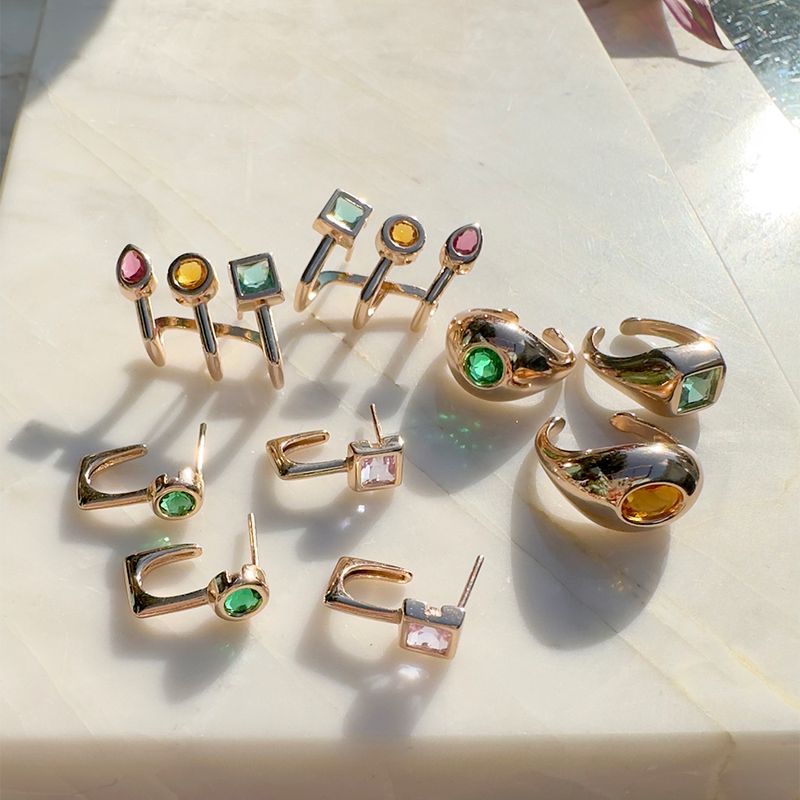 Brinco-meia-argola-cristal-esmeralda-banho-de-ouro-18k-nano-gold