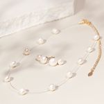 Brinco-perola-shell-design-boneco-de-neve-banho-de-ouro-18k