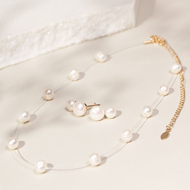 Brinco-perola-shell-design-boneco-de-neve-banho-de-ouro-18k