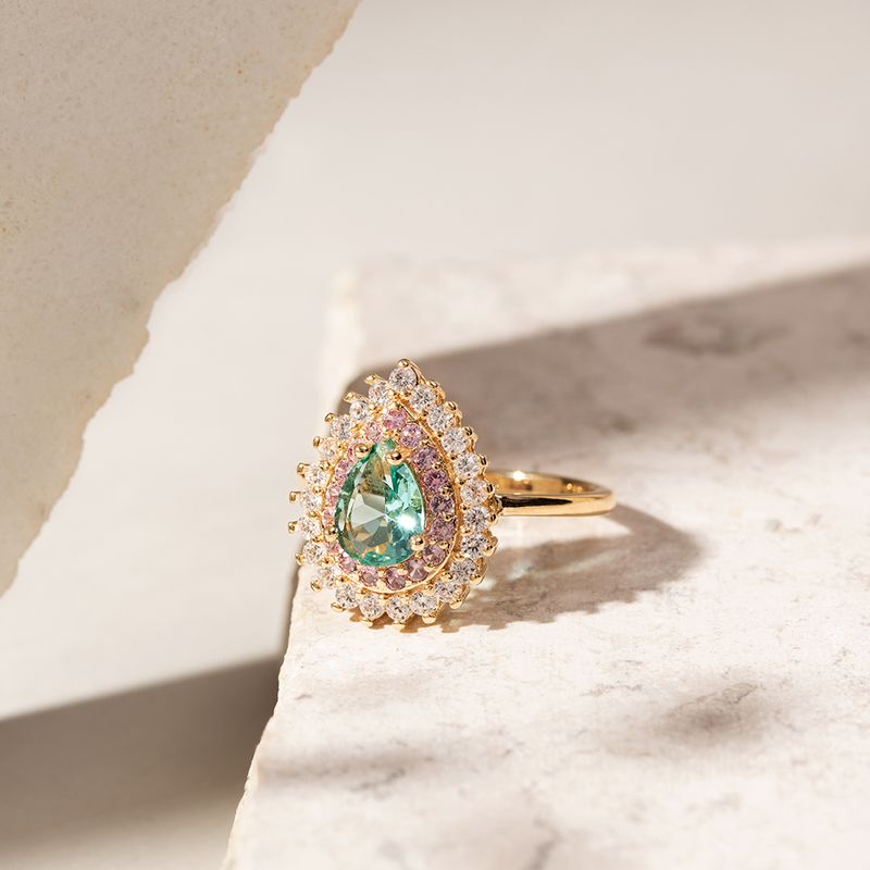 Anel-Gota-com-Cristal-Paraiba-e-Borda-Cravejada-com-Zirconias-Brancas-e-Rosas---Banho-de-Ouro-18k