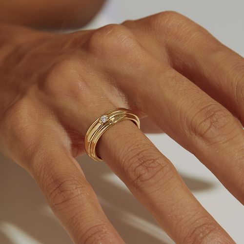 Anel Aliança Giratória com Ponto de Luz de Zircônia Branca - Banho de Ouro 18k